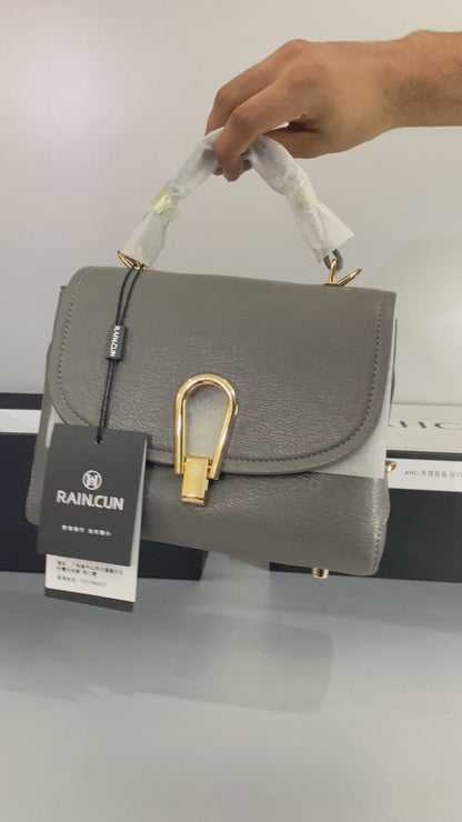 Elegant Grey Top-Handle Designer Handbag with Gold Accent Lock